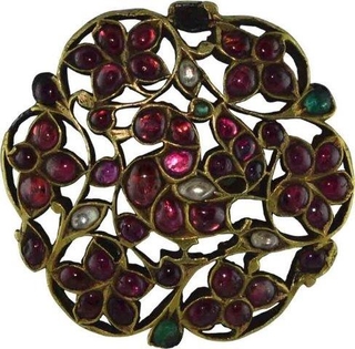 Antique Gold Brooch of Peacock Desigine with Rubies of Emeralds and sapphires.