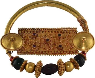 Tribal Gold Nose Ring from Madhya Pradesh Region with gem stones.