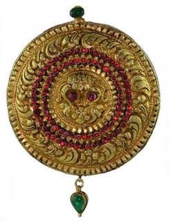 Gold Pendant of  Lord Narasimha Swami studded with Rubies and Emeralds.