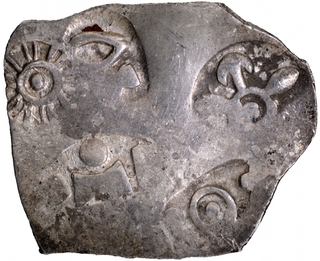 Punch Marked Silver Karshapana Coin of Magadha Janapada with geometric symbols.