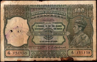 One Hundred Rupees Banknote of King George VI Signed by C D Deshmukh of Calcutta Circle of 1943.