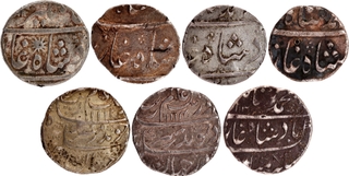 Mixed Lot of 7 Coins- Presidencies Silver ½ Rupee (1) & Rupee (4) & Nawabs of Surat Silver ½ Rupee (2).