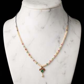 Marwar Region Antique Gold Necklace is articulated in flowing segments of ruby, pearl, and emerald.